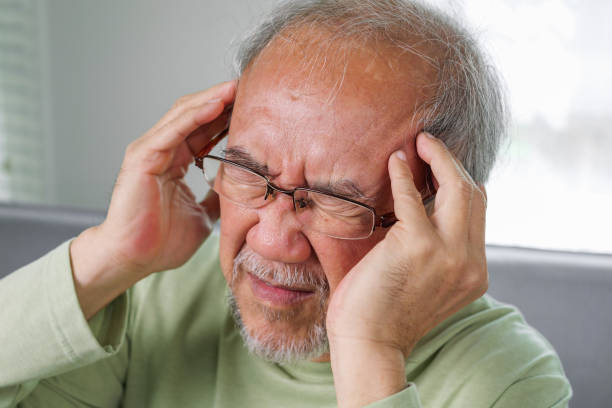 Senior Headache, Elderly with Dizzy. Elderly upset with headache, Senior constipation hand touch head. Senior man feeling suffer from terrible headache. Elderly have Migraine symptom